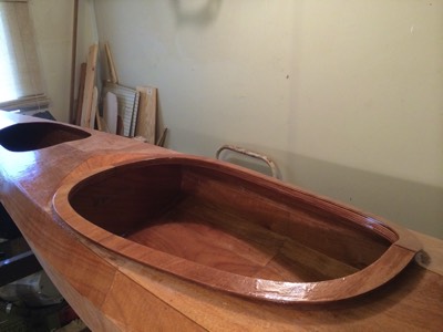  5/29/14 - The coaming is given a fill coat of epoxy. Also the aft bulkhead is tack-glued in place. 