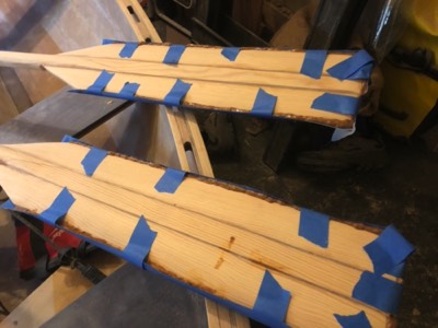  Thickened epoxy is applied around the tips of the oars to increase durability. 