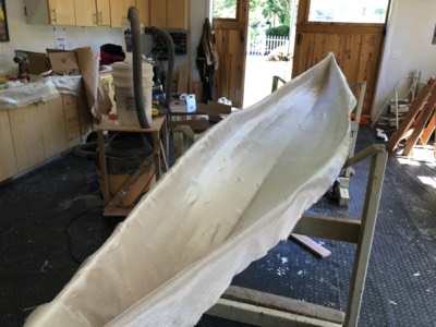  Fiberglass cloth is laid out on the hull interior. 