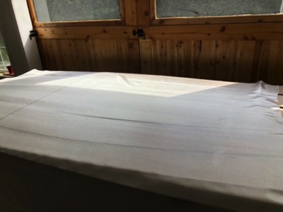  Fiberglass cloth is laid onto the hull panels. 
