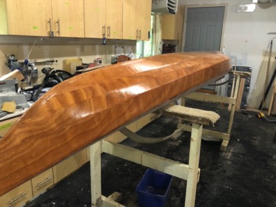 6/3/20 - The first coat of varnish is applied to the hull. 