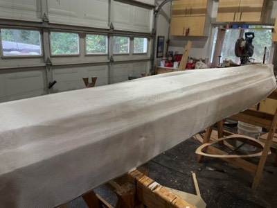  12/6/20 - Fiberglass cloth is laid on the hull.  