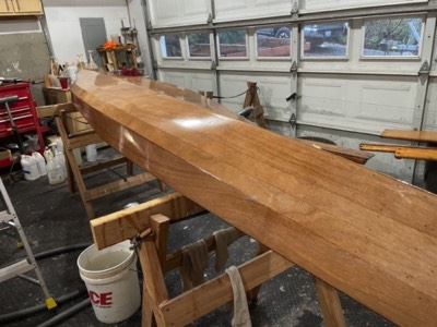  1/7/21 - The first coat of varnish is applied to the hull. 