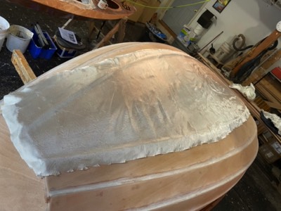  10/4/21 - Fiberglass is laid on the outside of the hull. 