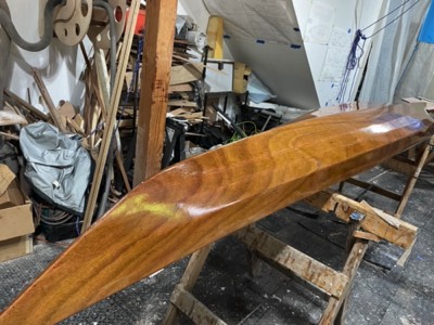  6/22/23 - First coat of varnish is applied to the hull.  