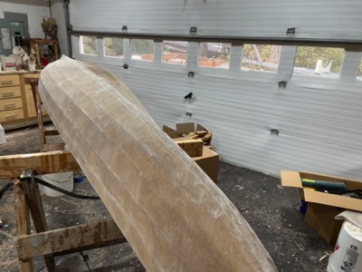  10/24/23 - Half of the hull is sanded in preparation for varnish. 
