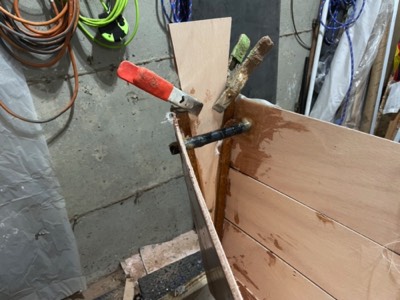  11/1/23 - Reinforcement panel is epoxied to the transom, and carrying handle tube is epoxied in place. 