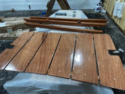  First coat of varnish on the queen seat top.  
