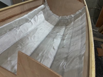  5/1/24 - Fiberglass cloth is laid in the cockpit section.  