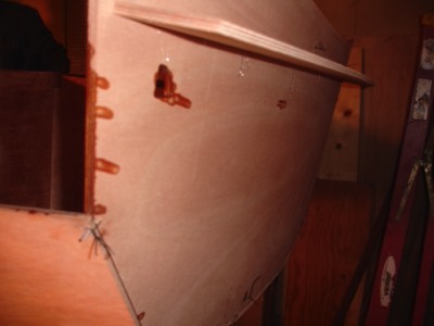  The piece on the back of the transom is temporary and will come off when the epoxy in the seams has fully cured. 