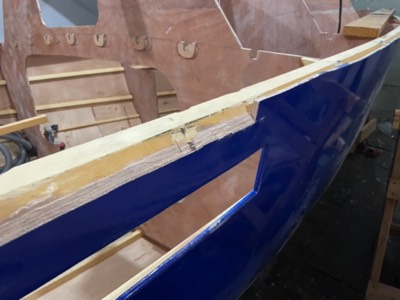  Overhanging hull panels are trimmed to match the sheer clamp. 