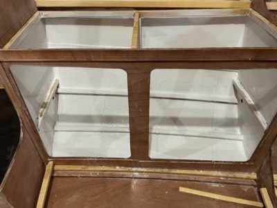  4/9/21 - Interior of galley cabinet is painted. 
