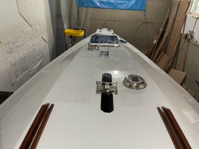  Vents, main hatch, mast step, and keel lift fittings are mounted. 