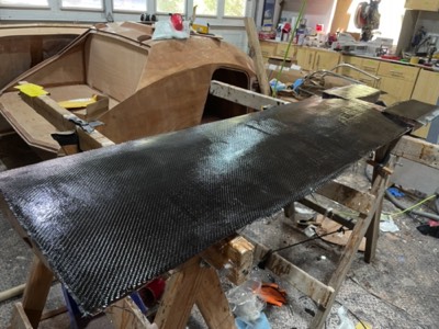  4/23/22 - A layer of 12 oz carbon fiber is added. 