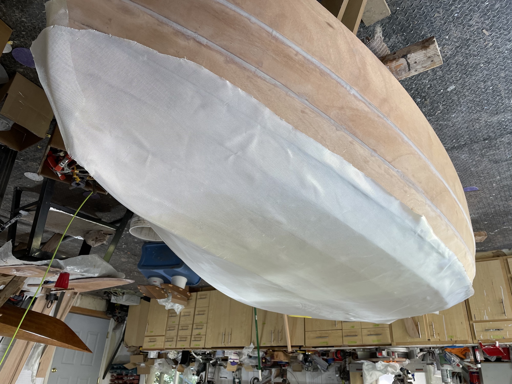  Fiberglass cloth is laid on the hull. 