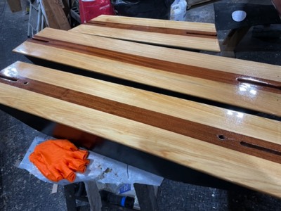  12/8/23 - First coat of varnish on the thwarts. 