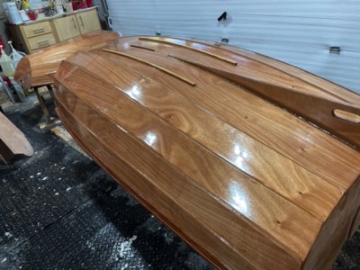  3/29/23 - First coat of varnish on the hull. 