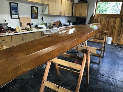  1/10/19 - The first coat of varnish is applied to the hull. 