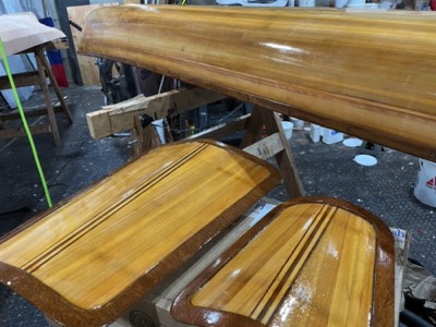  7/5/22 - Several coats of varnish are applied to the hull bottom and hatch covers. 