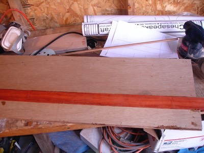  8/10/08 - Sheets of plywood and a piece of bloodwood are epoxied together for use as the leeboard. 