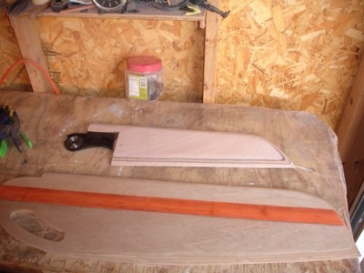  The rudder and leeboard are sanded and ready for fiberglass. 