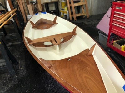  3/26/20 - The first coat of varnish is applied to the seats and bulkheads. 