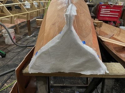  11/29/21 - Fiberglass is laid on the transom. 