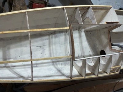  12/1/22 - The cabin is sanded in preparation for primer. 