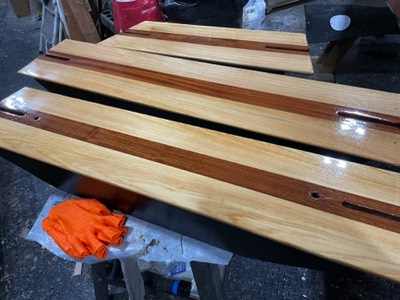  12/8/23 - First coat of varnish on the thwarts. 